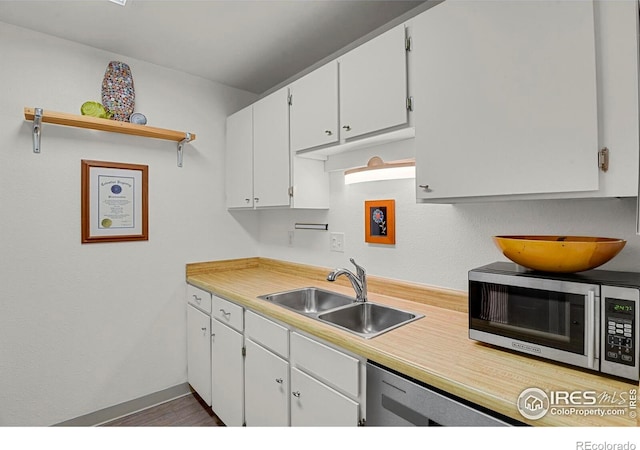 1113 Elysian Field Dr Unit A, Lafayette, CO 80026 - kitchen with appliances with stainless steel finishes, light countertops, and white cabinets