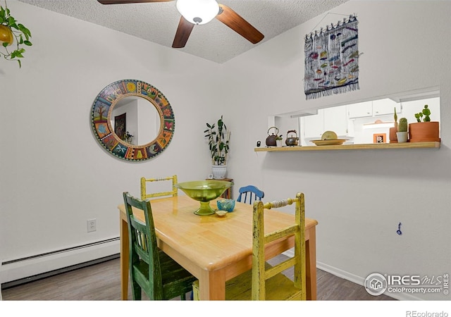1113 Elysian Field Dr Unit A, Lafayette, CO 80026 - dining area featuring a baseboard heating unit, wood finished floors, a textured ceiling, and a ceiling fan