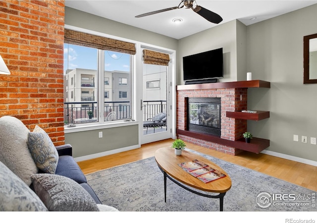 3601 Arapahoe Ave Unit 304, Boulder, CO 80303 - living room featuring wood finished floors, ceiling fan, and healthy amount of natural light