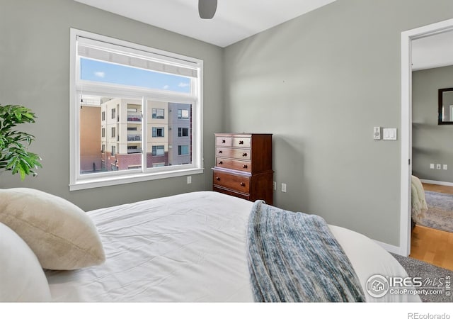 3601 Arapahoe Ave Unit 304, Boulder, CO 80303 - bedroom with wood finished floors and ceiling fan