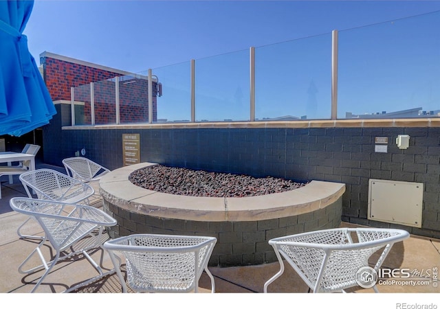 3601 Arapahoe Ave Unit 304, Boulder, CO 80303 - view of patio with an outdoor fire pit