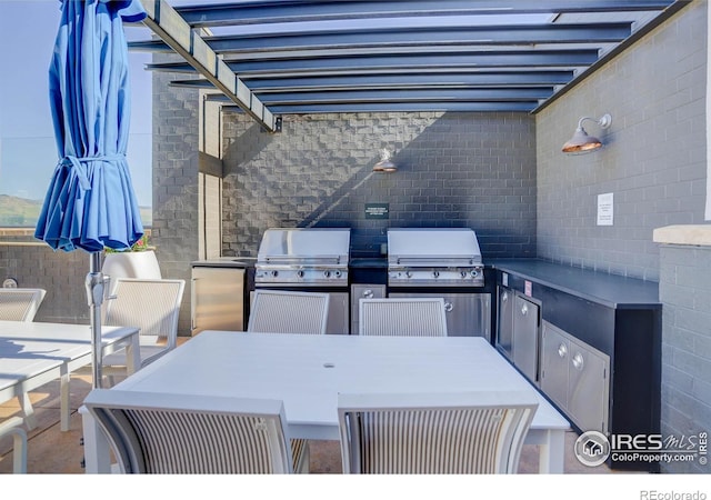 3601 Arapahoe Ave Unit 304, Boulder, CO 80303 - view of patio / terrace featuring outdoor dining space and area for grilling
