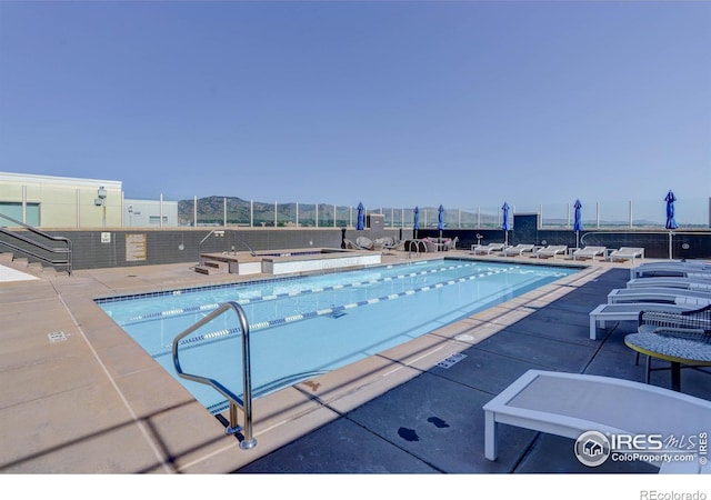 3601 Arapahoe Ave Unit 304, Boulder, CO 80303 - community pool featuring a patio and a community hot tub