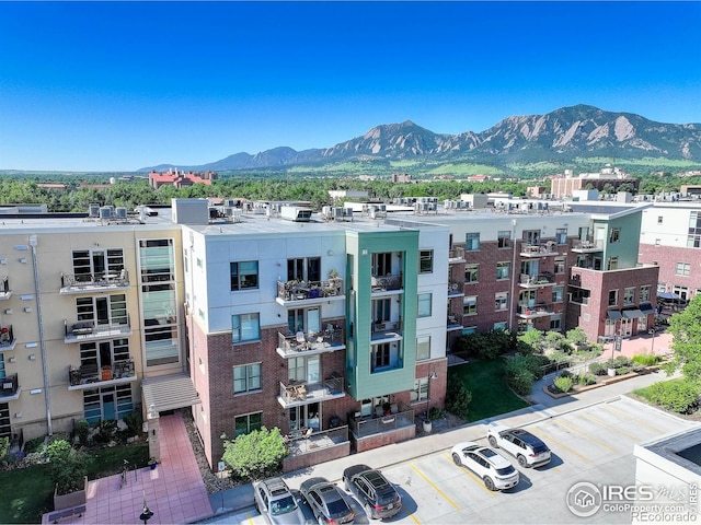 3601 Arapahoe Ave Unit 304, Boulder, CO 80303 - view of property featuring a mountain view and uncovered parking