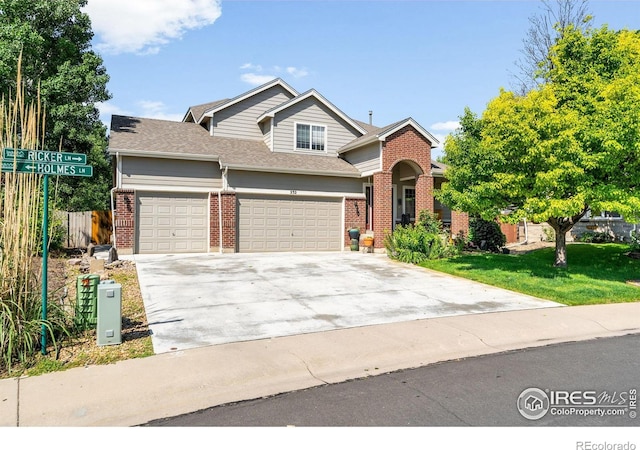232 Ricker Ln, Johnstown, CO 80534 - view of front of home featuring brick siding, a garage, concrete driveway, and a shingled roof