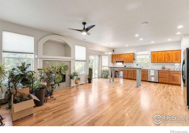 232 Ricker Ln, Johnstown, CO 80534 - kitchen with dishwasher, light wood-style flooring, recessed lighting, a chandelier, and a ceiling fan