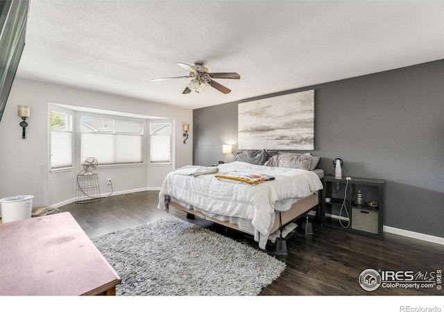232 Ricker Ln, Johnstown, CO 80534 - bedroom featuring wood finished floors and ceiling fan