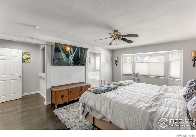 232 Ricker Ln, Johnstown, CO 80534 - bedroom featuring wood finished floors, a textured ceiling, a ceiling fan, and ensuite bath
