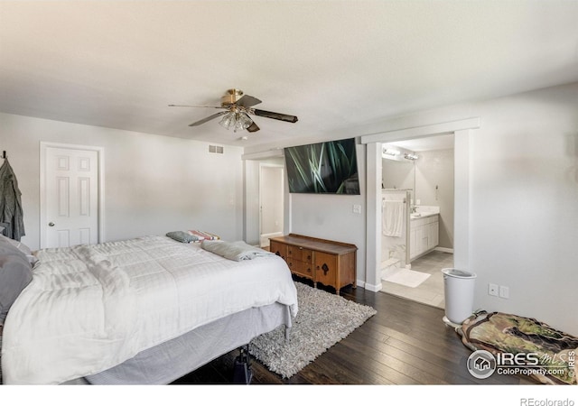 232 Ricker Ln, Johnstown, CO 80534 - bedroom with dark wood-type flooring, ensuite bathroom, and ceiling fan