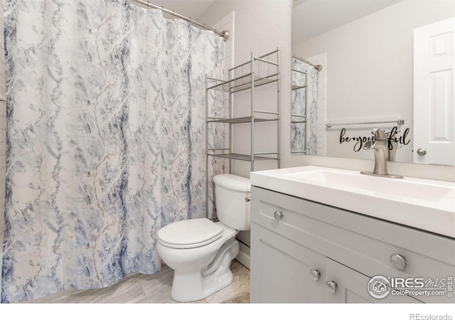 232 Ricker Ln, Johnstown, CO 80534 - bathroom featuring vanity and a shower with curtain