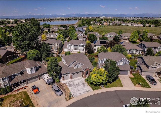 232 Ricker Ln, Johnstown, CO 80534 - aerial perspective of suburban area featuring a nearby body of water