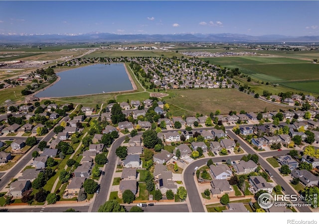 232 Ricker Ln, Johnstown, CO 80534 - aerial view of property and surrounding area featuring a large body of water and nearby suburban area