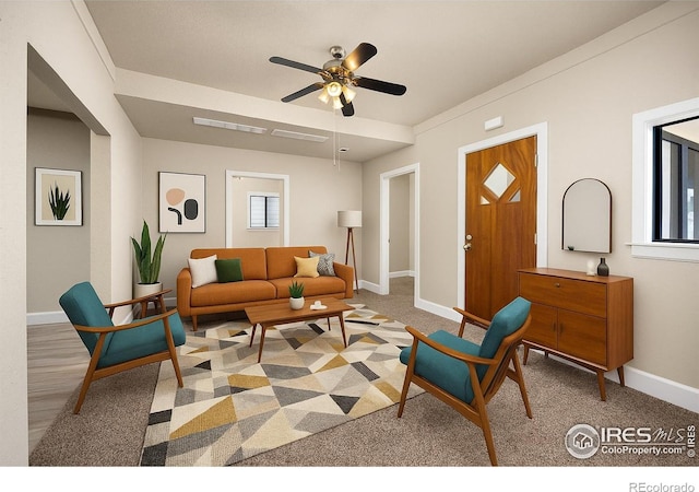 311 12th Ave, Greeley, CO 80631 - living room featuring a ceiling fan and light carpet