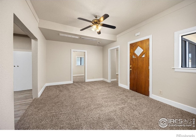 311 12th Ave, Greeley, CO 80631 - carpeted entrance foyer featuring ceiling fan and baseboards