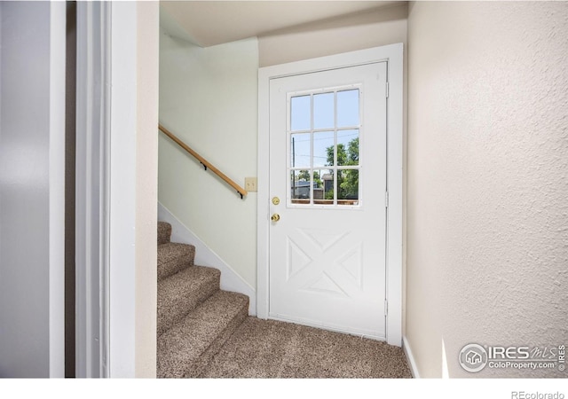311 12th Ave, Greeley, CO 80631 - entryway featuring carpet floors and stairway
