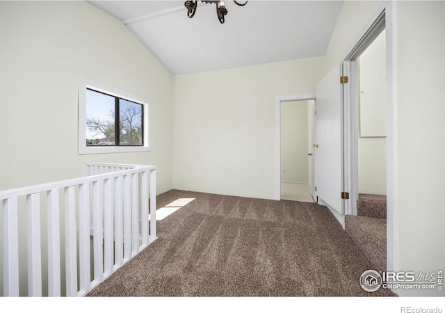 311 12th Ave, Greeley, CO 80631 - unfurnished bedroom featuring carpet and vaulted ceiling