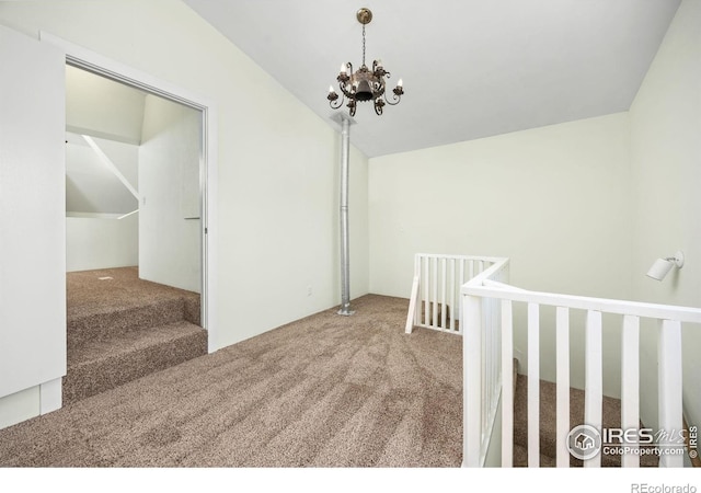 311 12th Ave, Greeley, CO 80631 - carpeted spare room with a chandelier and vaulted ceiling