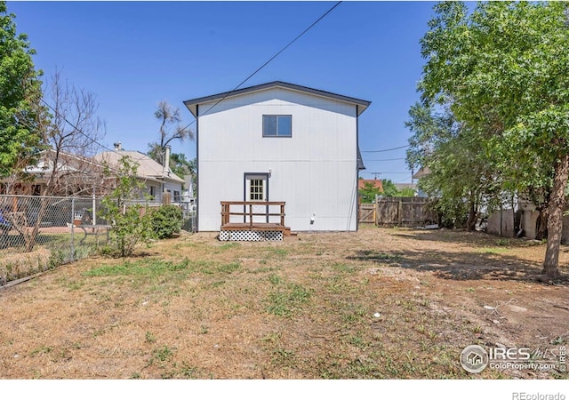 311 12th Ave, Greeley, CO 80631 - back of house featuring a fenced backyard