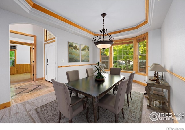 8416 Starfish Ct, Windsor, CO 80528 - dining area with a raised ceiling, arched walkways, and parquet flooring