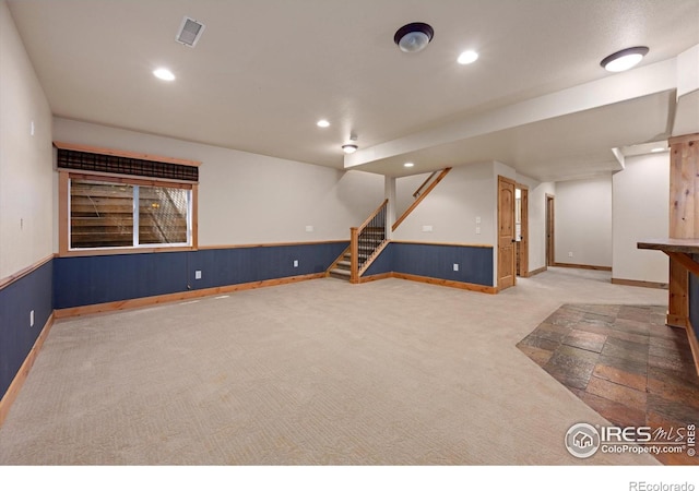 8416 Starfish Ct, Windsor, CO 80528 - finished basement featuring carpet, recessed lighting, stairs, wainscoting, and wood walls