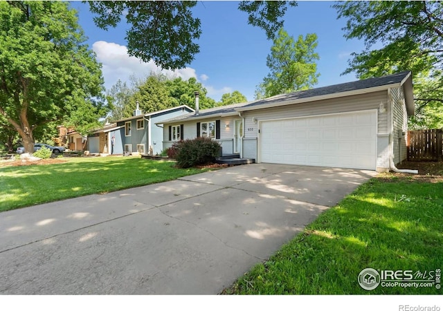 930 Vanderbilt Ct, Fort Collins, CO 80525 - view of front of house featuring an attached garage and driveway