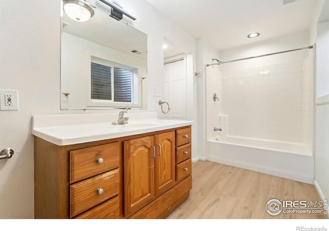 930 Vanderbilt Ct, Fort Collins, CO 80525 - full bath with vanity, wood finished floors, and shower / bath combination