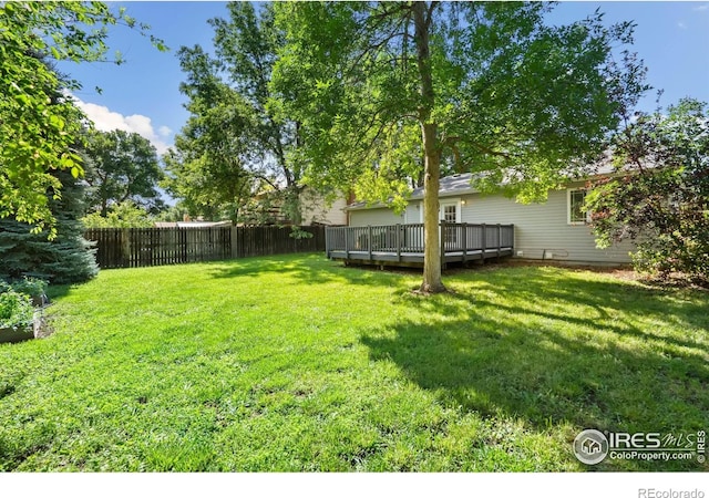 930 Vanderbilt Ct, Fort Collins, CO 80525 - fenced backyard with a wooden deck