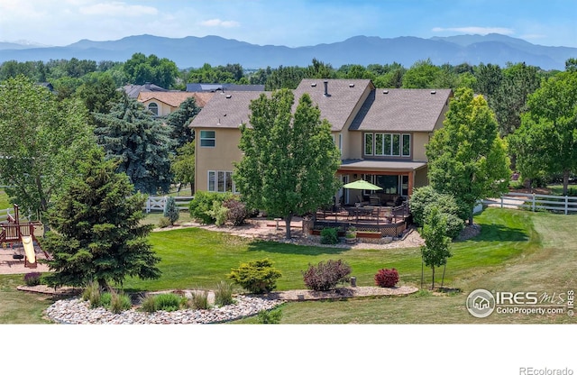14652 Kalamath Ct, Westminster, CO 80023 - back of house featuring a deck with mountain view and stucco siding
