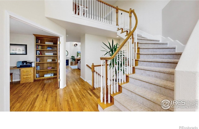 14652 Kalamath Ct, Westminster, CO 80023 - stairway with wood finished floors and a high ceiling