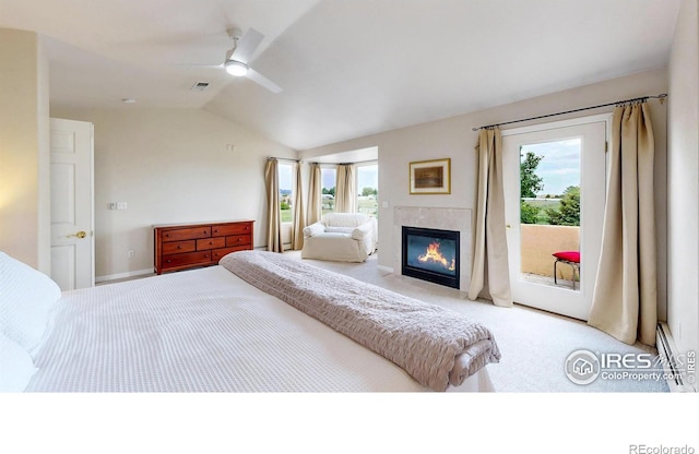 14652 Kalamath Ct, Westminster, CO 80023 - bedroom with multiple windows, lofted ceiling, access to outside, carpet floors, and a fireplace