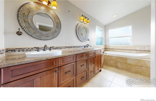 14652 Kalamath Ct, Westminster, CO 80023 - bathroom with a garden tub, double vanity, tile patterned flooring, and vaulted ceiling