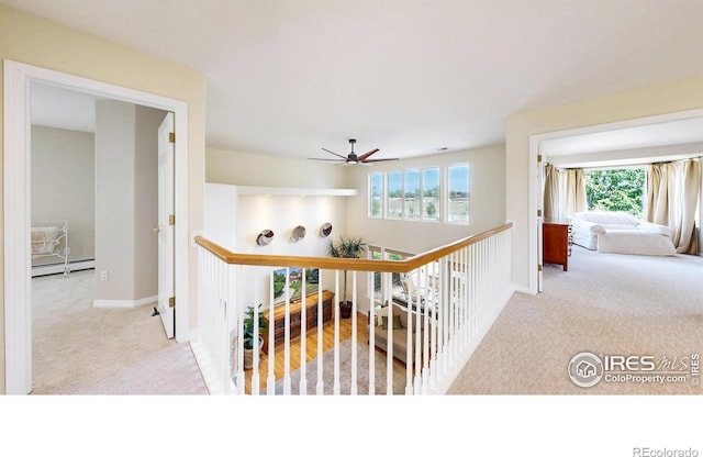 14652 Kalamath Ct, Westminster, CO 80023 - hall featuring carpet, baseboard heating, an upstairs landing, and healthy amount of natural light