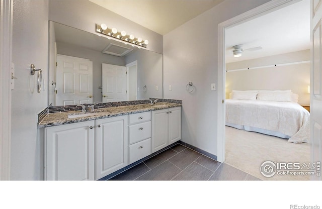 14652 Kalamath Ct, Westminster, CO 80023 - full bath with double vanity, ensuite bathroom, and a ceiling fan