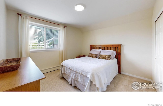 14652 Kalamath Ct, Westminster, CO 80023 - bedroom with baseboard heating, light colored carpet, and a closet
