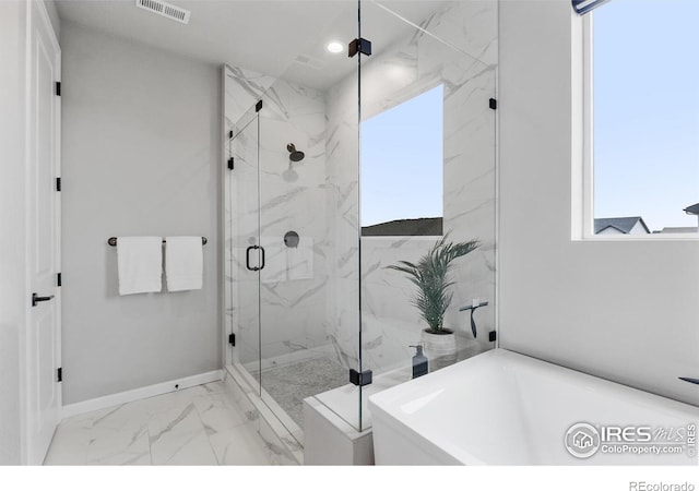 5056 Blanchette St, Timnath, CO 80547 - full bath featuring marble finish flooring, a bathtub, a marble finish shower, and recessed lighting