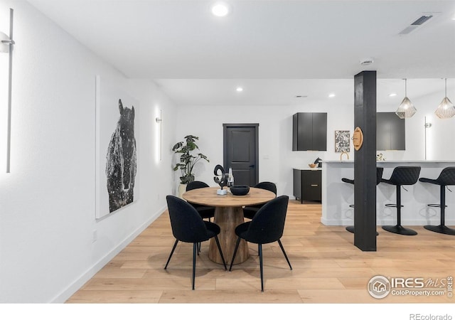 5056 Blanchette St, Timnath, CO 80547 - dining room featuring light wood finished floors and recessed lighting