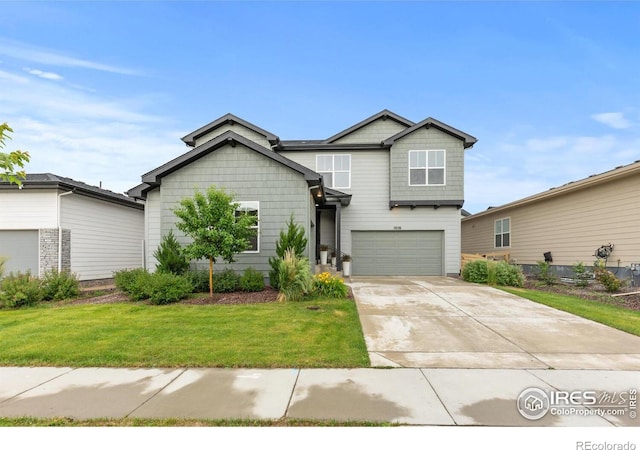 5056 Blanchette St, Timnath, CO 80547 - view of front of property featuring driveway, an attached garage, and a front yard