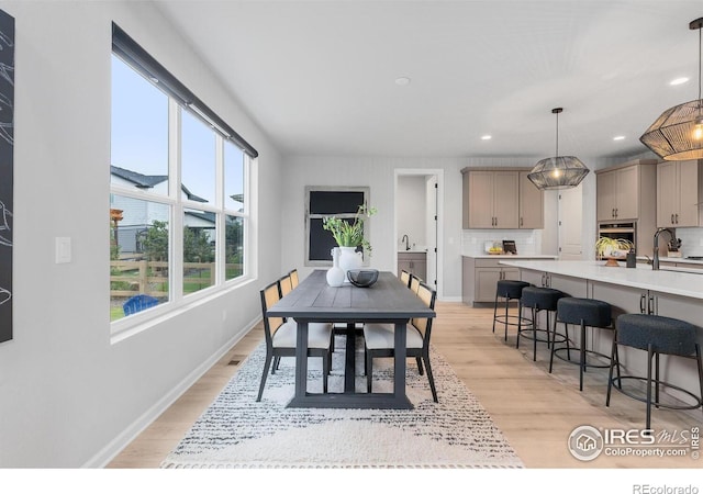 5056 Blanchette St, Timnath, CO 80547 - dining room featuring light wood-type flooring and recessed lighting