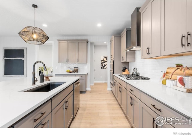 5056 Blanchette St, Timnath, CO 80547 - kitchen featuring appliances with stainless steel finishes, wall chimney exhaust hood, recessed lighting, decorative backsplash, and light countertops