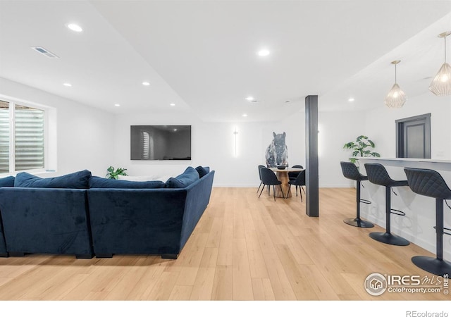 5056 Blanchette St, Timnath, CO 80547 - living area with light wood-style floors and recessed lighting