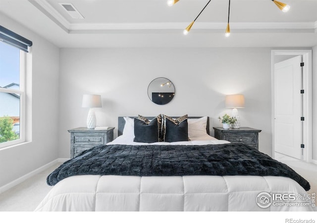 5056 Blanchette St, Timnath, CO 80547 - carpeted bedroom with multiple windows, crown molding, and a tray ceiling