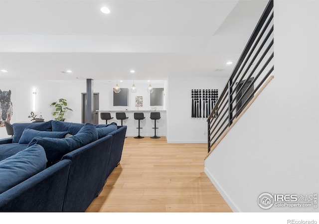 5056 Blanchette St, Timnath, CO 80547 - living room with stairs, light wood-style floors, and recessed lighting