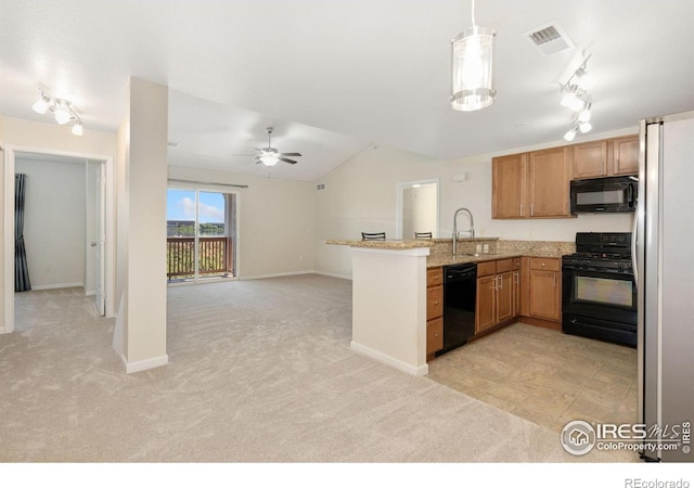 4905 Hahns Peak Dr Unit 202, Loveland, CO 80538 - kitchen featuring black appliances, track lighting, a peninsula, light carpet, and open floor plan