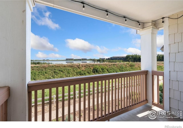 4905 Hahns Peak Dr Unit 202, Loveland, CO 80538 - balcony featuring a water view