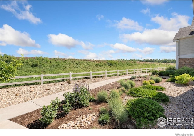 4905 Hahns Peak Dr Unit 202, Loveland, CO 80538 - view of yard featuring a view of countryside