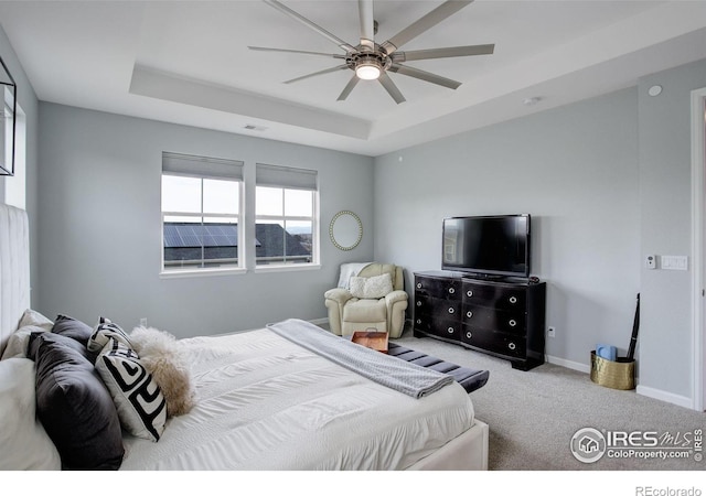 12917 Fox St, Westminster, CO 80234 - bedroom featuring a tray ceiling, carpet flooring, and a ceiling fan