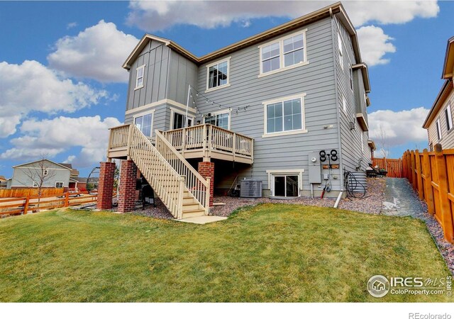 12917 Fox St, Westminster, CO 80234 - back of property featuring board and batten siding, a fenced backyard, a deck, and stairway