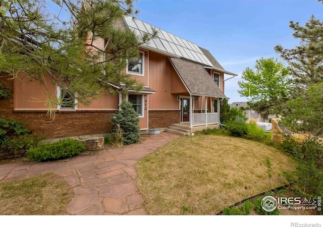 412 Terry Point Dr, Fort Collins, CO 80524 - view of front facade with a front lawn and brick siding