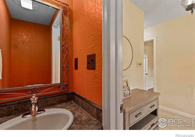 412 Terry Point Dr, Fort Collins, CO 80524 - bathroom with vanity and a textured wall