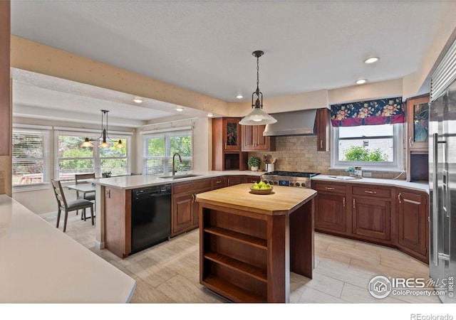 412 Terry Point Dr, Fort Collins, CO 80524 - kitchen featuring dishwasher, wall chimney range hood, wooden counters, a peninsula, and open shelves